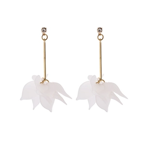Detailed view of long daisy petal earrings with white acrylic flowers and gold finish