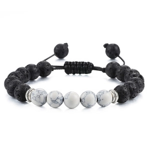 Detail of adjustable beaded bracelet with black lava rocks and white marble stones