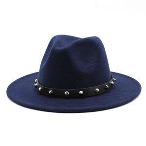 Detail of navy blue wide brim fedora with black leather band and silver metal studs