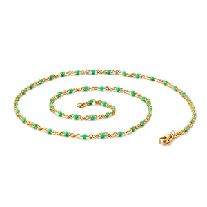 Minimalist gold titanium steel necklace with green resin beads on white background