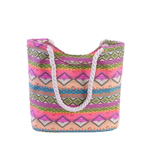 Colorful geometric pattern canvas tote bag with woven rope handles in bohemian style