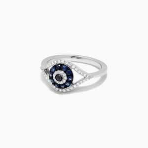 Detailed view of the multi-color stone-set evil eye motif on a silver band ring