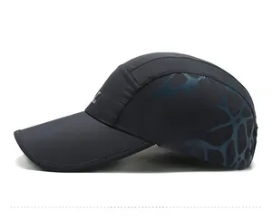 Detailed side view of dark grey quick-dry baseball cap with blue geometric mesh pattern