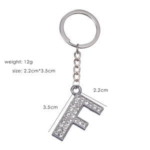 Detail of silver letter F keychain with sparkling rhinestones showing 2.2x3.5cm dimensions