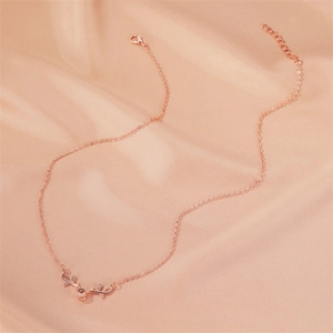 Detailed view of rose gold elk antler necklace with projection stone on silk
