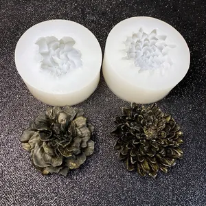DIY floral silicone mold set with finished 3D resin flower models on a black background