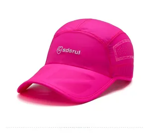 Detail view of breathable side mesh and logo on rose red quick-dry sports cap