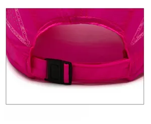 Detail of adjustable black plastic buckle on rose pink breathable mesh baseball cap