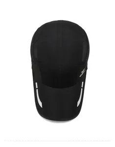 Top view of black quick-dry sport cap with mesh side panels and reflective brim details
