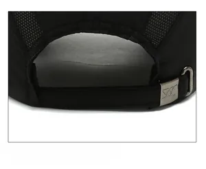 Detail of adjustable metal buckle and breathable mesh on black sports baseball cap