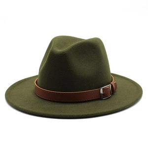 Detail of dark green wool fedora hat featuring a brown leather band and metal buckle