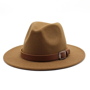 Close-up of camel wool fedora hat with brown leather band and silver metal buckle detail