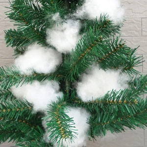 Artificial Christmas tree branches with decorative white cotton snow for window display