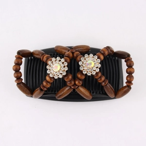 Detail of double hair comb with brown wooden beads and sparkling crystal flower accents
