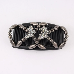 Detailed view of black magic hair comb with grey beads and sparkling rhinestone butterflies