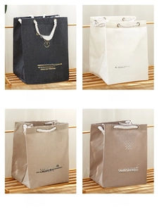 Detail view of cotton canvas storage bags in four colors with thick rope handles