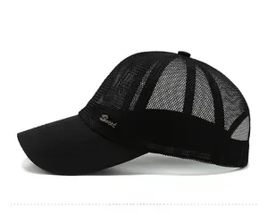 Detail view of black mesh baseball cap with metal Sport logo and breathable texture