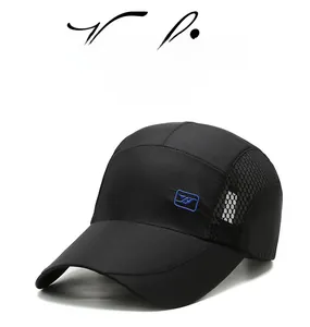 Detail of breathable mesh side panel and blue embroidered logo on black baseball cap