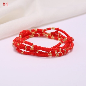 Detail of multi-layered handmade red and gold seed bead chain for beach fashion style