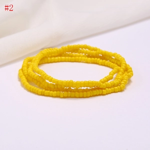 Detail shot of multi-layer yellow seed beads waist chain for summer beach style