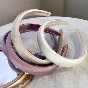 Elegant padded satin headbands in cream, champagne, and purple silk-like fabric set