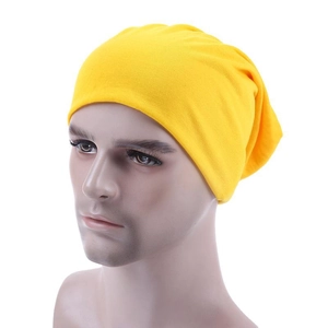 Unisex yellow knit slouchy beanie for sports or thin medical headwear on white background