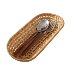 Oval woven rattan serving tray in natural light brown for home kitchen and dining decor