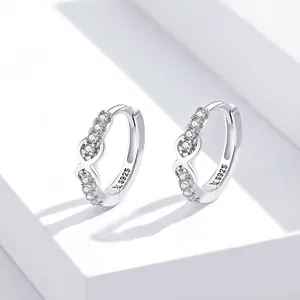 Polished S925 sterling silver infinity hoop earrings with small white crystals
