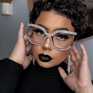 Detail of rose gold oversized glasses frame with sparkling white rhinestones on model