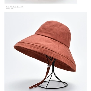 Detail of wide brim sun hat with parallel stitching and adjustable drawstring cord