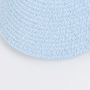 Detailed close-up showing the fine spiral woven texture of this light blue sun straw hat