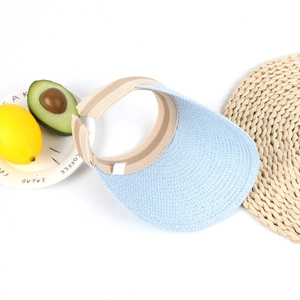 Detail of baby straw sun hat featuring breathable woven texture and soft sweatband