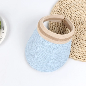 Detail of light blue woven sun visor with elastic striped headband on white background