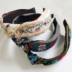 Three-piece set of ethnic embroidered knotted headbands with floral bohemian patterns