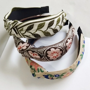 Three vintage embroidered knot headbands in floral patterns for women's hair styling