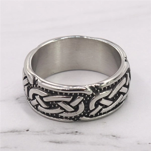 Vintage stainless steel Celtic knot ring with antiqued finish and polished inner band