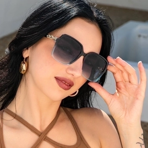 Fashionable oversized square sunglasses with gradient lenses and gold metal hinge accents