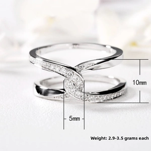 Detail of silver crisscross ring with zircons, 10mm height and 2.9-3.5g weight