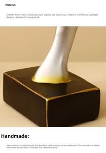 Detail of handcrafted resin angel wing sculpture base with black and gold finish