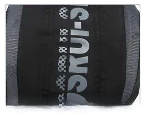 Detailed macro view of the double-stitched seam and gray letter print on the black cap top