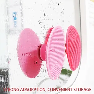Pink silicone facial cleansing brush with suction cup storage for easy mounting