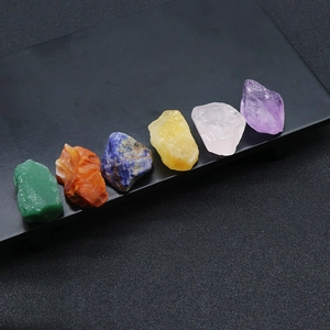 Set of 6 natural rough crystals including amethyst and lapis lazuli on black tray