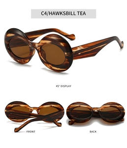 Detail view of oval tortoiseshell sunglasses in Hawksbill Tea with retro striped texture