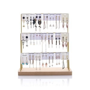 Three-tier gold metal earring stand with natural wooden base for jewelry display