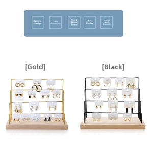 Detailed view of 4-tier jewelry display stands with wooden bases in gold and black finishes