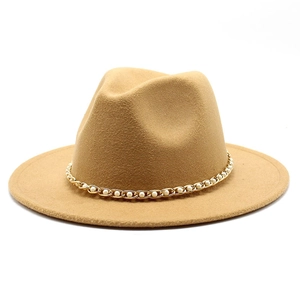 Detailed texture of camel wool fedora hat featuring elegant pearl and gold chain band