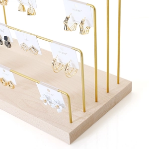 Minimalist wood and gold metal jewelry stand for earring and necklace display