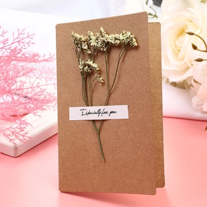 Detail of kraft greeting card with dried flowers and 'Especially for you' label