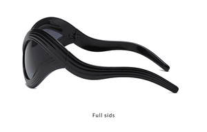 Detail view of avant-garde cat eye sunglasses with futuristic wavy black plastic frames