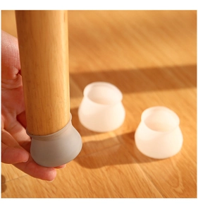 Silicone chair leg floor protectors in translucent and grey colors for wood floors